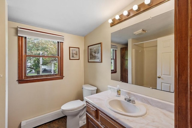 128 Arthur Ave, Athol, MA 01331 - bathroom featuring a baseboard radiator, toilet, vanity, a shower, and baseboards