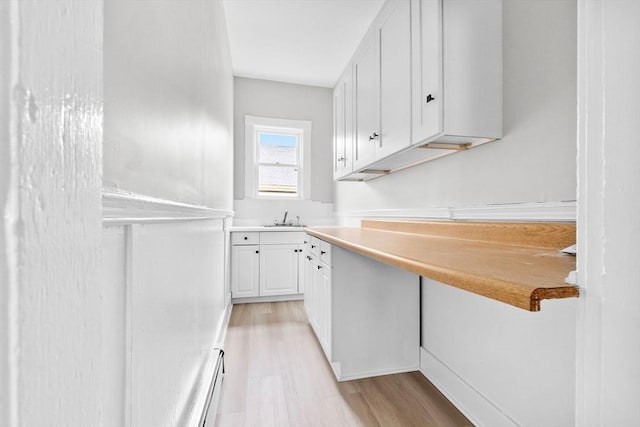 11 Barr St, Salem, MA 01970 - kitchen featuring white cabinets, light wood-type flooring, and light countertops