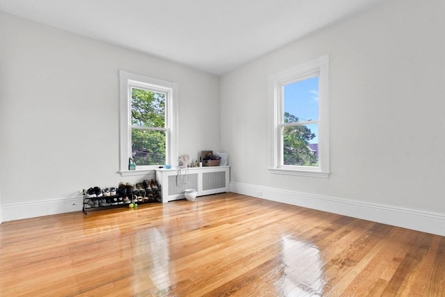 11 Barr St, Salem, MA 01970 - unfurnished room featuring radiator and wood finished floors