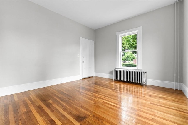 11 Barr St, Salem, MA 01970 - empty room featuring radiator heating unit and hardwood / wood-style floors
