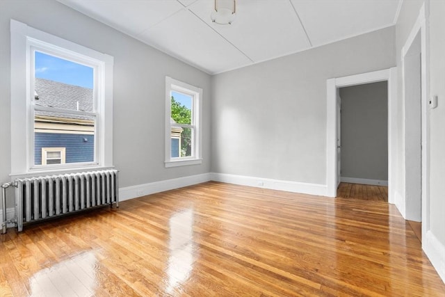 11 Barr St, Salem, MA 01970 - spare room with radiator and light wood-style flooring