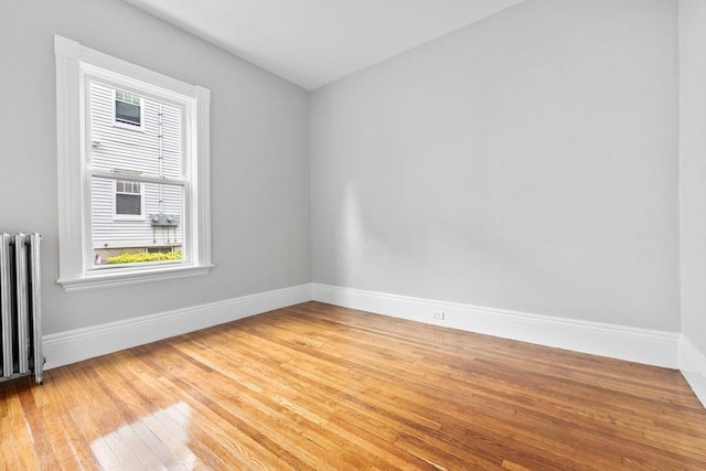 11 Barr St, Salem, MA 01970 - spare room with radiator, healthy amount of natural light, and light wood finished floors