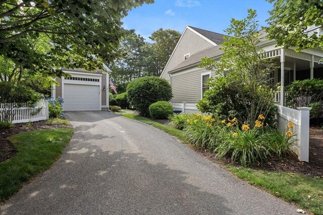 view of side of property with a garage