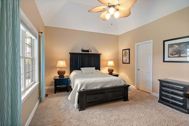 carpeted bedroom with multiple windows, lofted ceiling, and ceiling fan