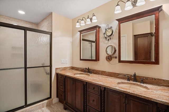 bathroom featuring walk in shower, tile patterned floors, and dual bowl vanity