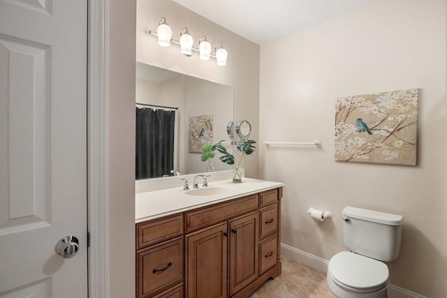 bathroom featuring vanity, a shower with curtain, tile patterned floors, and toilet