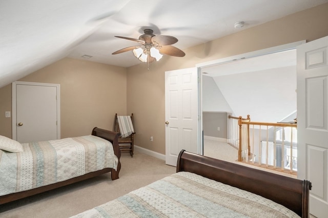 carpeted bedroom featuring ceiling fan and lofted ceiling