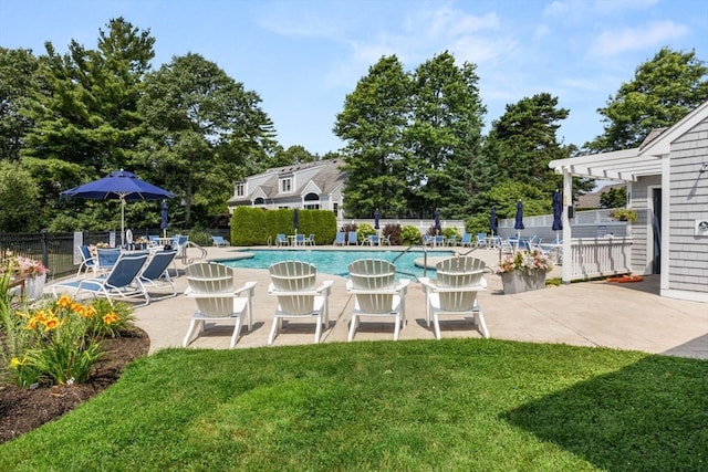 view of pool featuring a pergola, a lawn, and a patio area