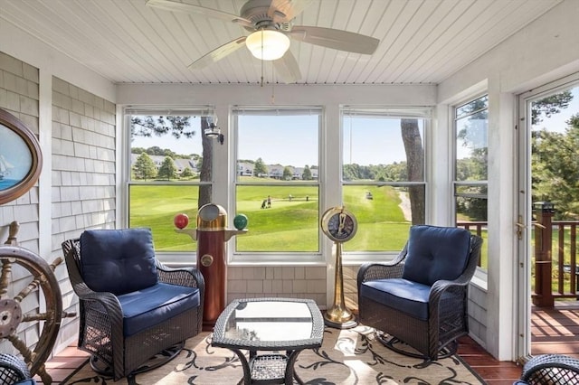sunroom / solarium featuring wood ceiling and ceiling fan