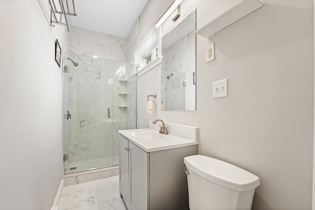 21 Minot St Unit 2A, Boston, MA 02122 - bathroom featuring marble look tile flooring, a marble finish shower, vanity, toilet, and baseboards