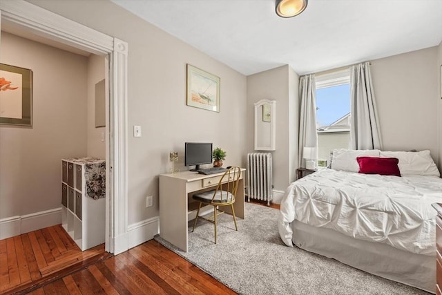 21 Minot St Unit 2A, Boston, MA 02122 - bedroom featuring radiator heating unit, hardwood / wood-style flooring, and baseboards