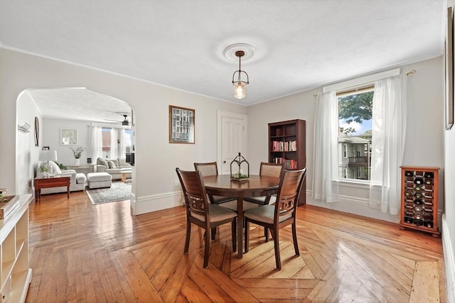 21 Minot St Unit 2A, Boston, MA 02122 - dining space featuring arched walkways, baseboards, and ornamental molding