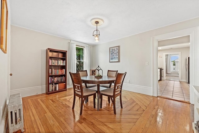 21 Minot St Unit 2A, Boston, MA 02122 - dining room with baseboards and light wood-style flooring