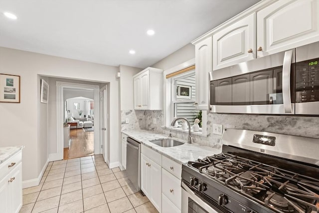 21 Minot St Unit 2A, Boston, MA 02122 - kitchen featuring stainless steel appliances, a sink, white cabinetry, baseboards, and recessed lighting