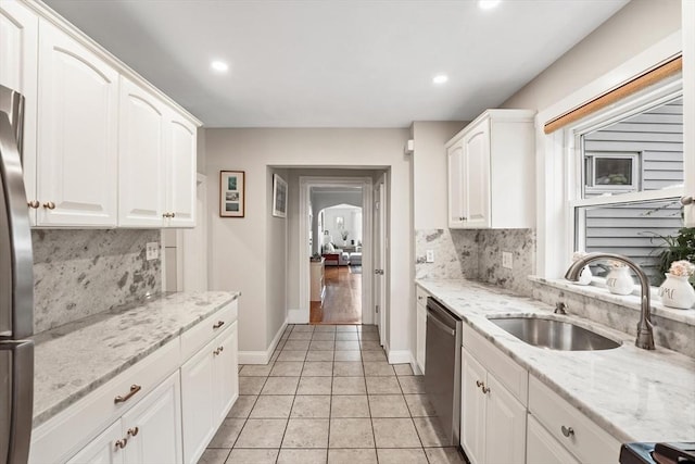 21 Minot St Unit 2A, Boston, MA 02122 - kitchen with a sink, appliances with stainless steel finishes, backsplash, white cabinets, and recessed lighting