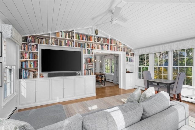 living room featuring lofted ceiling, baseboard heating, light wood finished floors, built in features, and wood ceiling