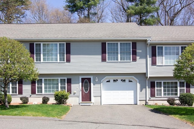 51 Pinecrest Dr Unit 51, Chicopee, MA 01020 - view of front of house featuring asphalt driveway, an attached garage, and a front lawn