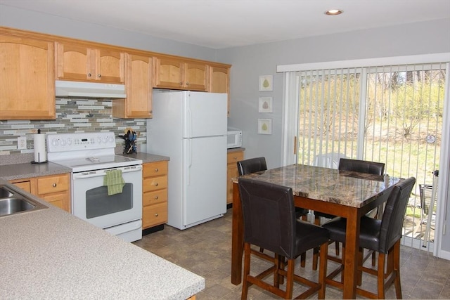 51 Pinecrest Dr Unit 51, Chicopee, MA 01020 - kitchen with white appliances, under cabinet range hood, healthy amount of natural light, backsplash, and recessed lighting