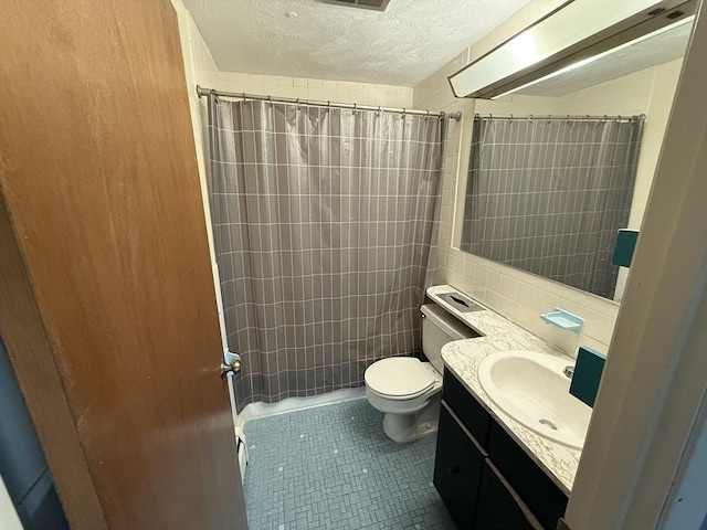 924 Main St Unit 26, Woburn, MA 01801 - full bath featuring vanity, a shower with curtain, tile patterned flooring, and a textured ceiling