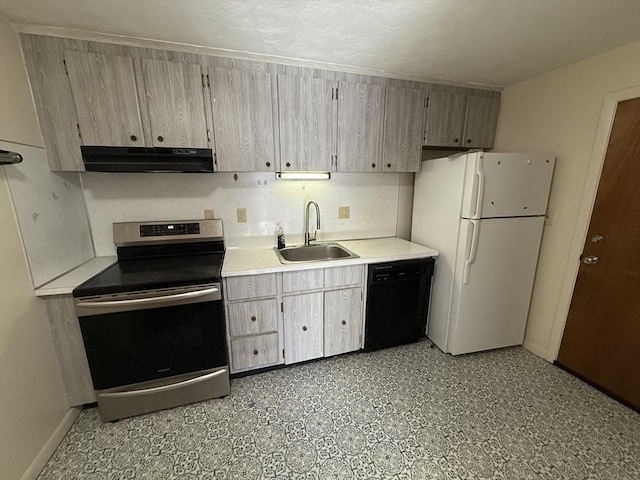 924 Main St Unit 26, Woburn, MA 01801 - kitchen featuring electric range, under cabinet range hood, dishwasher, freestanding refrigerator, and light countertops