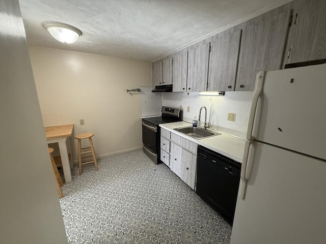 924 Main St Unit 26, Woburn, MA 01801 - kitchen featuring freestanding refrigerator, electric range, dishwasher, under cabinet range hood, and light countertops