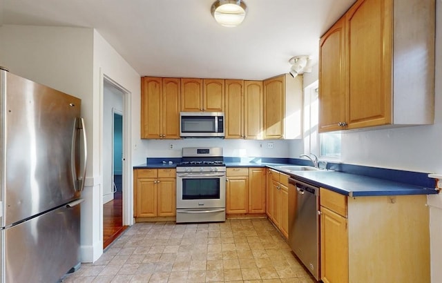 461 Arborway Unit 2, Boston, MA 02130 - kitchen with appliances with stainless steel finishes, a sink, and stone finish flooring