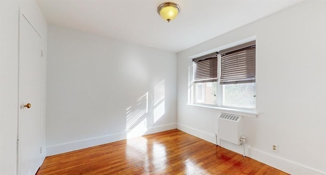 461 Arborway Unit 2, Boston, MA 02130 - empty room with baseboards and wood finished floors