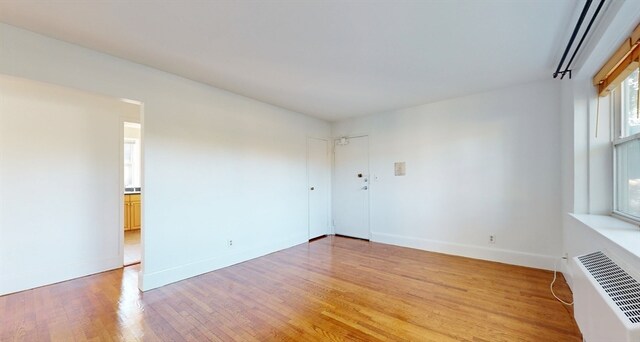 unfurnished room featuring hardwood / wood-style floors