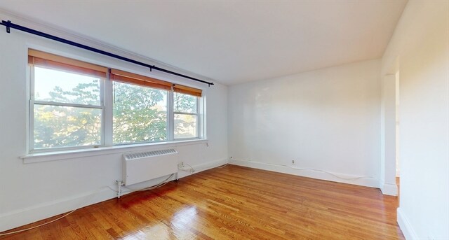 empty room with light wood-type flooring