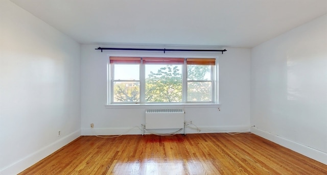 spare room with light hardwood / wood-style floors