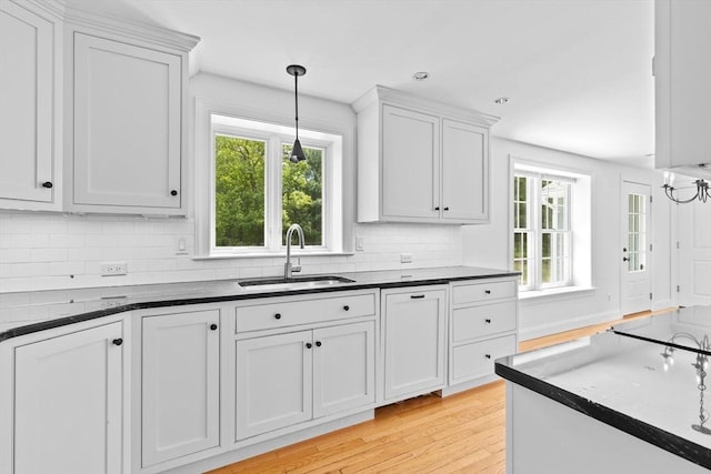 258 Plympton Rd, Plymouth, MA 02360 - kitchen with a sink, plenty of natural light, dark countertops, tasteful backsplash, and recessed lighting