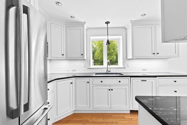 258 Plympton Rd, Plymouth, MA 02360 - kitchen with freestanding refrigerator, a sink, tasteful backsplash, white cabinets, and recessed lighting