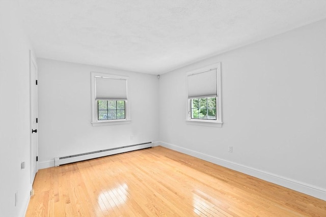 258 Plympton Rd, Plymouth, MA 02360 - unfurnished room with baseboard heating, hardwood / wood-style floors, plenty of natural light, and baseboards