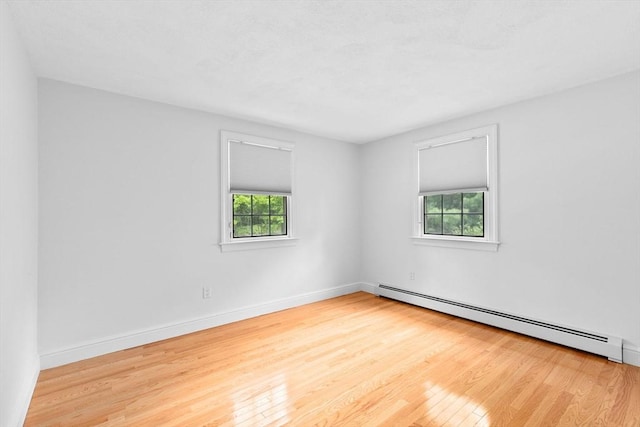 258 Plympton Rd, Plymouth, MA 02360 - empty room featuring a baseboard radiator, wood finished floors, and baseboards