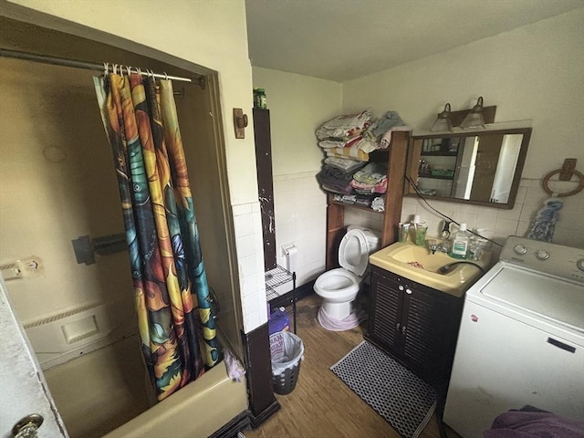 55 Canton St, Fitchburg, MA 01420 - full bath with washer / clothes dryer, wood finished floors, vanity, and shower / bathtub combination with curtain