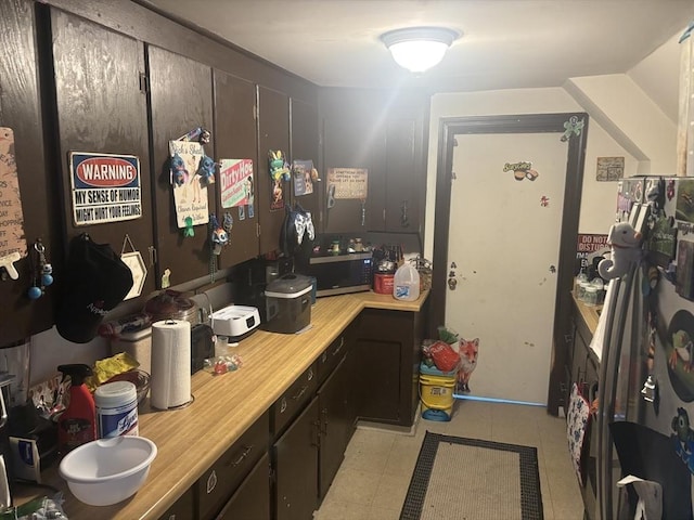55 Canton St, Fitchburg, MA 01420 - kitchen with light countertops and light tile patterned floors