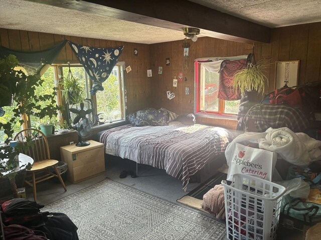55 Canton St, Fitchburg, MA 01420 - bedroom with multiple windows, wooden walls, a textured ceiling, and carpet floors