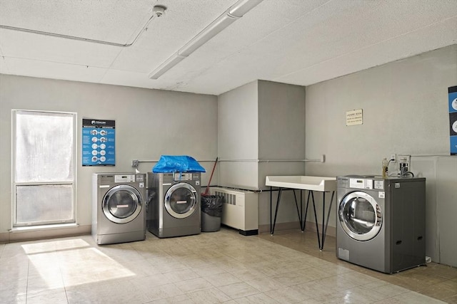 community laundry room featuring washer and dryer