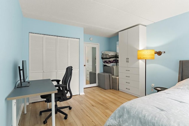 bedroom with a closet and light wood-type flooring