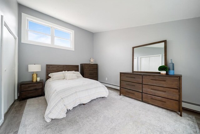 27 Mason Ct Unit 27, Amesbury, MA 01913 - bedroom with baseboard heating and light wood finished floors