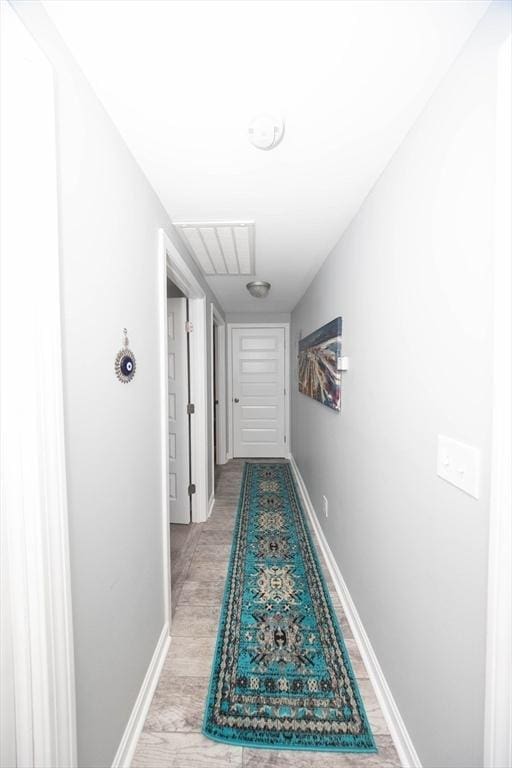 corridor with visible vents and baseboards