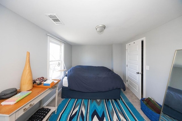 bedroom featuring visible vents and carpet flooring