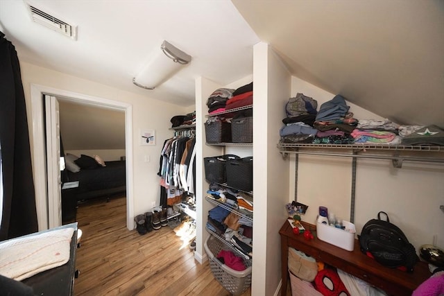 spacious closet with visible vents and wood finished floors