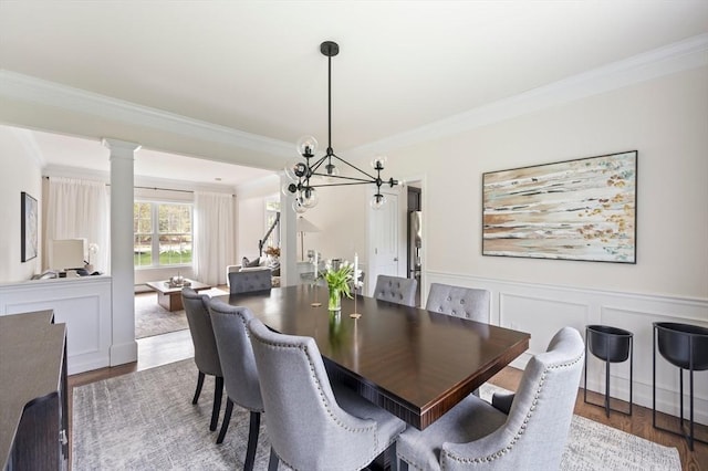 86 Pioneer Trl, Plymouth, MA 02360 - dining area with crown molding, dark wood-type flooring, a wainscoted wall, decorative columns, and a decorative wall