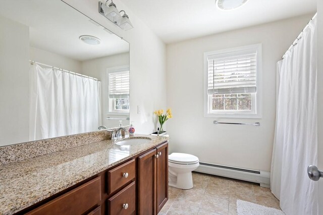 86 Pioneer Trl, Plymouth, MA 02360 - full bathroom with a baseboard radiator, toilet, vanity, and tile patterned floors