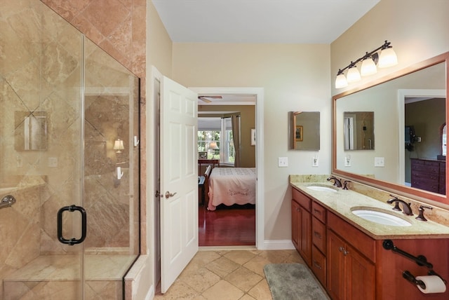 bathroom featuring vanity and an enclosed shower