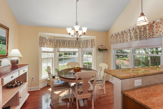 dining room with vaulted ceiling, a chandelier, and dark hardwood / wood-style flooring