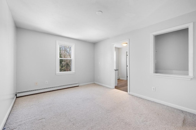 carpeted empty room with baseboards and baseboard heating