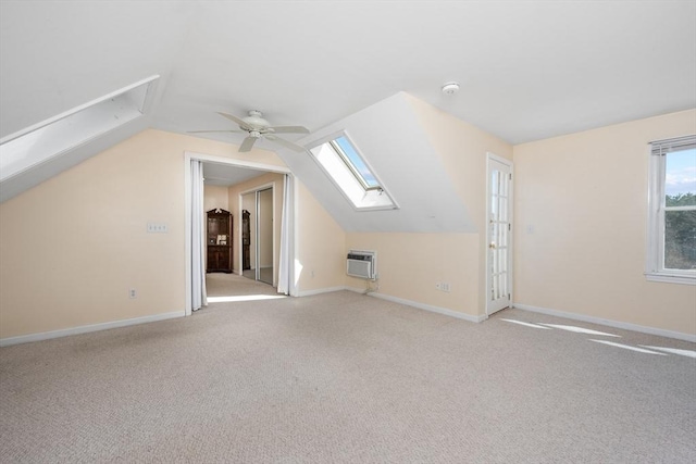 bonus room featuring baseboards, carpet floors, an AC wall unit, and ceiling fan