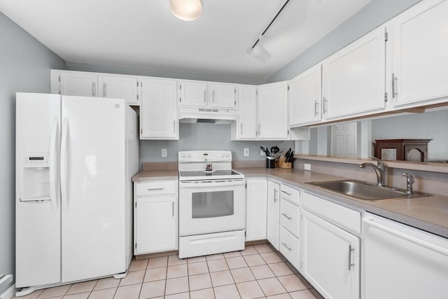 kitchen featuring under cabinet range hood, white cabinets, white appliances, and a sink